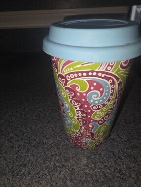 Longaberger Travel Mug with Blue Lid and Colorful Swirl Pattern.